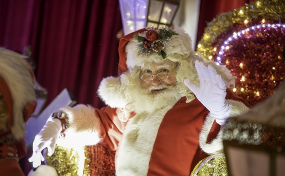 Jolly Santa Claus waving 